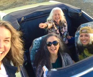 Photo of members of Fanny in a convertible